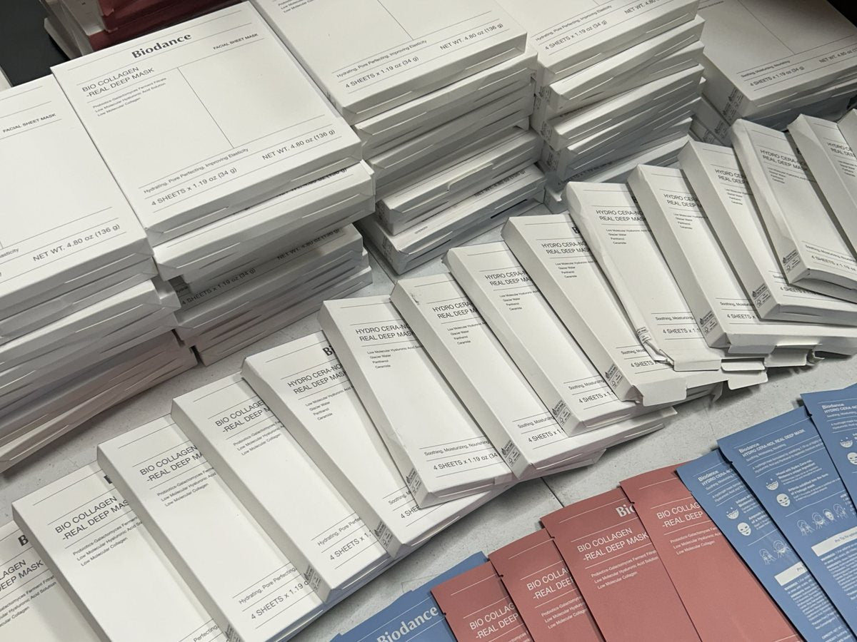 Sheet mask and ampoule sachets laid out for inspection