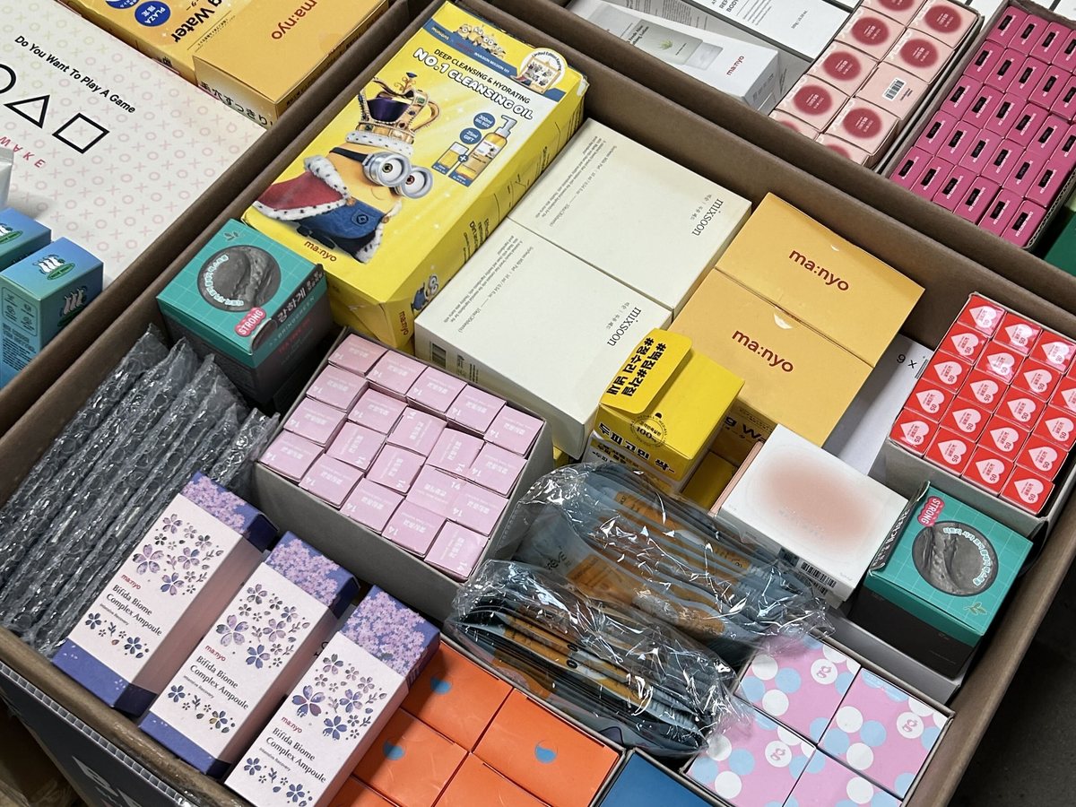 Mixed beauty products arranged across a pallet